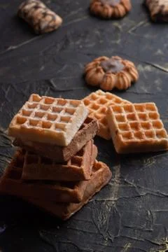 Stack of waffles on a black table, cookies background, Stock Photos