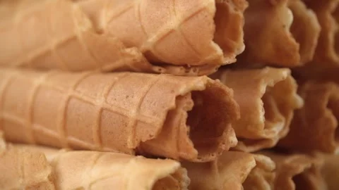 Stack of waffles in form of rolls, rotates closeup. ready-made pastries cookery Stock Footage 242459963