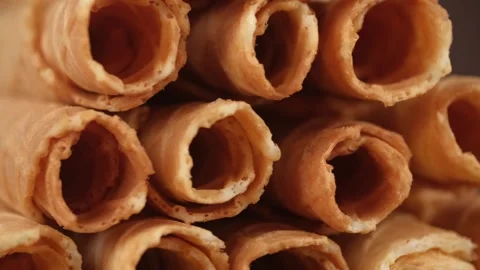 Stack of waffles in the form of rolls, rotates closeup. cookery, bakery. Stock-Footage 243336728