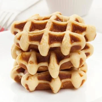 Stack of waffles on white plate closeup Stock Photos