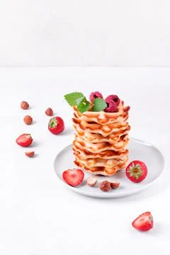 Stack of waffles on white table 스톡 사진