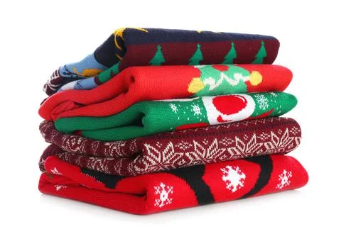 Stack of warm Christmas sweaters isolated on white 스톡 사진