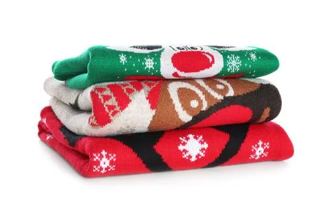 Stack of warm Christmas sweaters isolated on white 스톡 사진