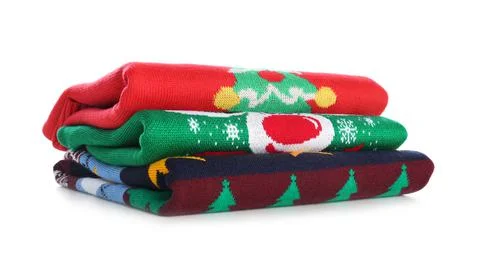 Stack of warm Christmas sweaters isolated on white Stockfoto's