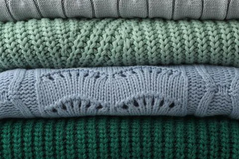 Stack of warm clothes as background, closeup. Autumn season 스톡 사진