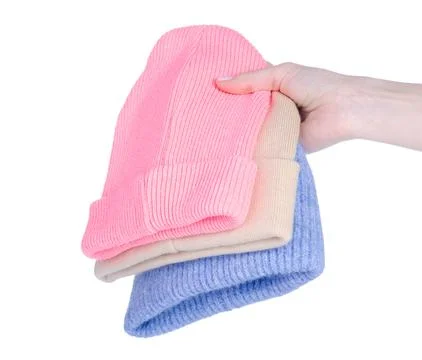 Stack of warm hats in hand Stock Photos