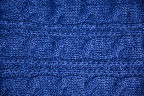 Stack of Warm knitwear close-up. Woolen knit texture as background Stock Photos