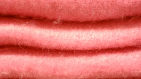 Stack of warm pink knitted sweaters close-up, texture and background. Stock Footage 295915007