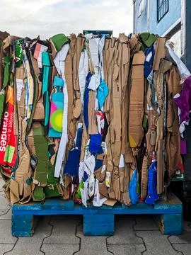 A stack of waste paper from pressed cardboard boxes. Waste sorting and recy.. 스톡 사진