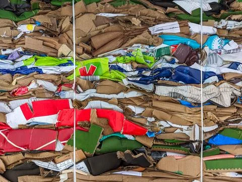 A stack of waste paper from pressed cardboard boxes. Waste sorting and recy.. 스톡 사진