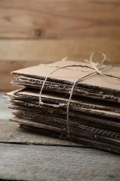 Stack of waste paper on wooden table, closeup 스톡 사진