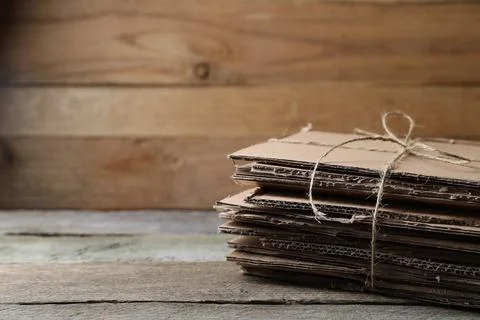 Stack of waste paper on wooden table, closeup. Space for text 스톡 사진