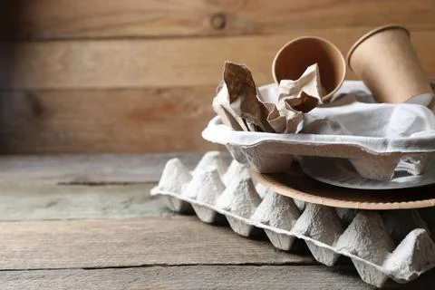 Stack of waste paper on wooden table, closeup. Space for text Stockfoto's