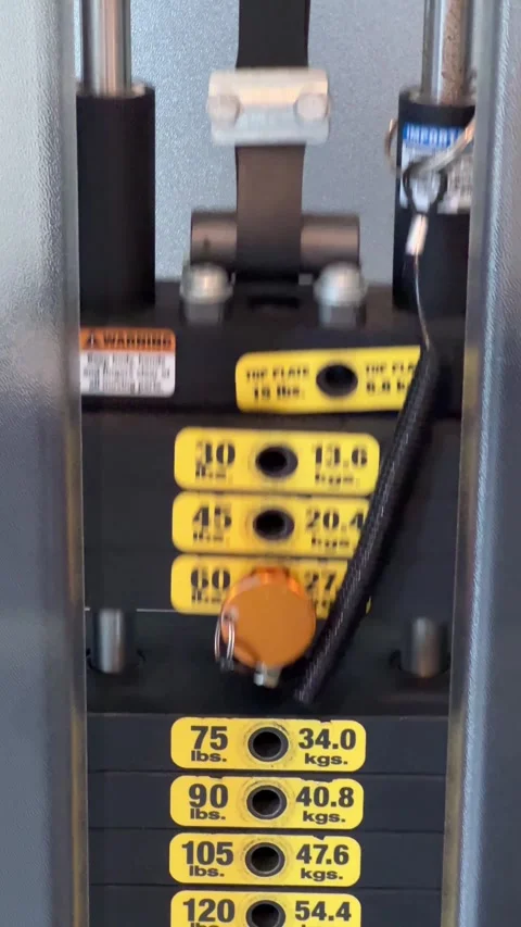 Stack of weights moving from exercise on a gym weight machine Stock Footage 285419932