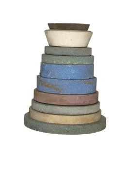 Stack of whetstones of various shapes and sizes isolated on a white backgroun Stock Photos