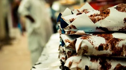Stack of white and brown paper wrapping on table 스톡 사진