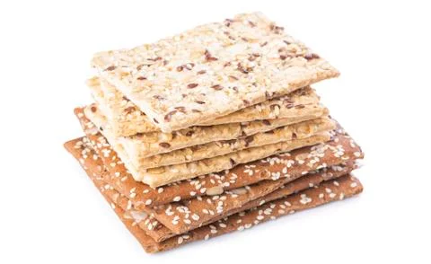 A stack of white and brown sesame crackers Stock Photos