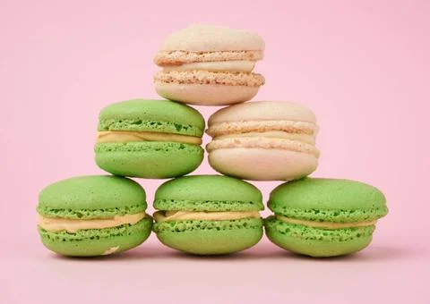 Stack of white and green round almond flour cakes macarons stack of white ... Stock-Fotos