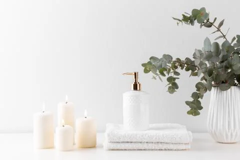 Stack of white bath towels, soap and candles Stock Photos