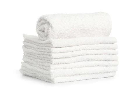 Stack of white beach soft towels folded on white background Stock Photos
