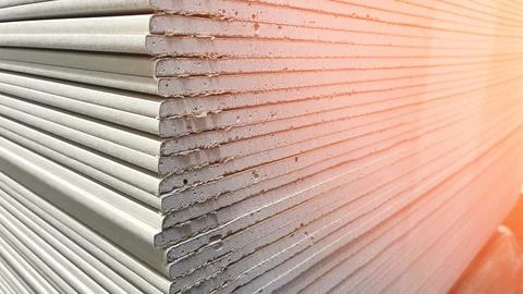 A stack of white boards with a gray stripe down the middle. The boards are stack Foto stock