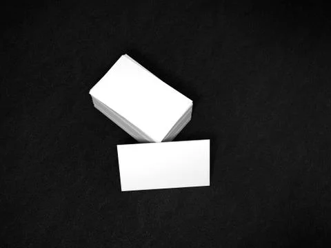Stack of white business cards. Namecards mockup template on black leather Stock Illustration