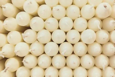 Stack of white candles creates a pattern Stock Photos