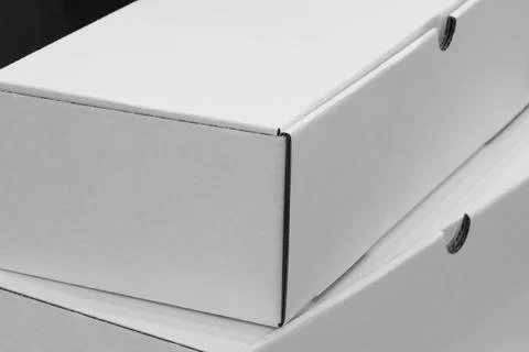 A stack of white cardboard boxes as background for template pages and banners Stock Photos