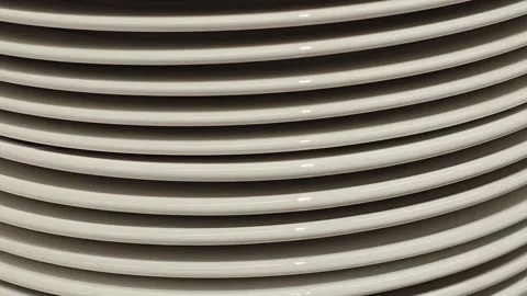 Stack of white ceramic plates on a shelf Stock Footage 344694301