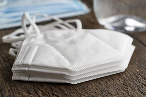 A stack of white FFP2 or KN95 respirators, destined to prevent the coronaviru Stock Photos