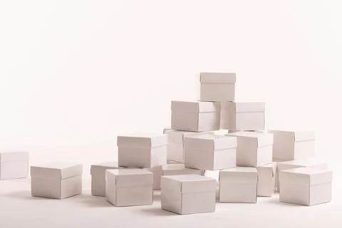 Stack of white gift boxes and copy space over white background 스톡 사진
