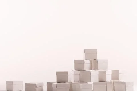 Stack of white gift boxes and copy space over white background Foto stock