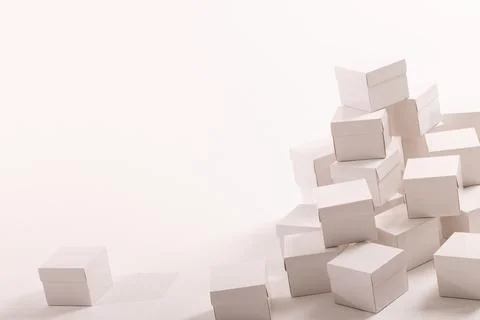 Stack of white gift boxes and copy space over white background Stock Photos