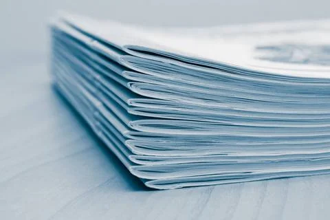Stack of white journals Stack of white journals on table, closeup blue ton... Stock Photos