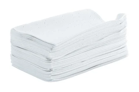 Stack of white liquidless and powderless laundry detergent squares sheets Фото