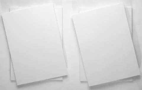 Stack of white office paper on light background, top view, place for text. 写真素材