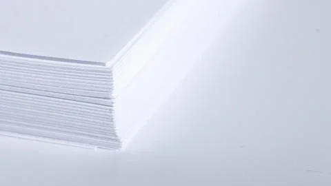 Stack of white office paper on light background, top view, place for text. 스톡 사진