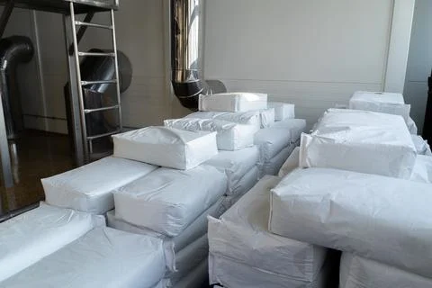 A stack of white paper bags. Stock Photos