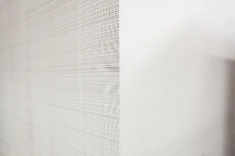 Stack of white paper close-up detail. Close-up view on the slice of paper sta Stock Photos