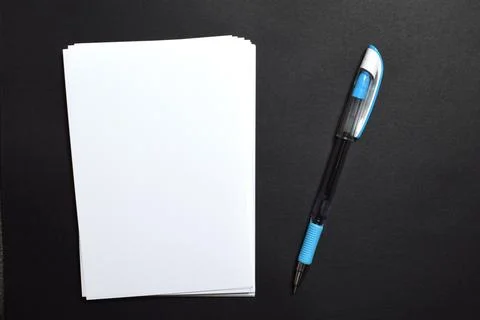 Stack of white paper with a pen Stock Photos
