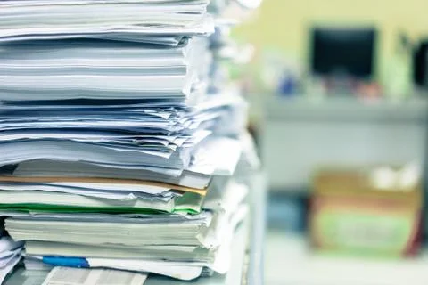 Stack of white paper placed in the office. Stock Photos