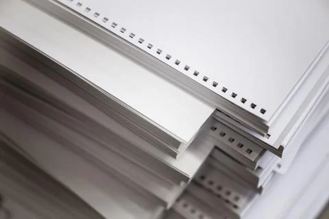 Stack of white perforated paper Photos