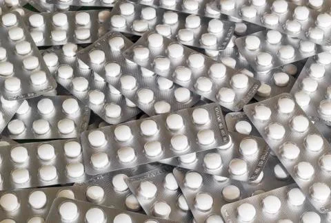 Stack of white pills in blister pack Stock Photos
