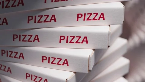 Stack of white pizza boxes with red PIZZA text Stock Footage 163549103