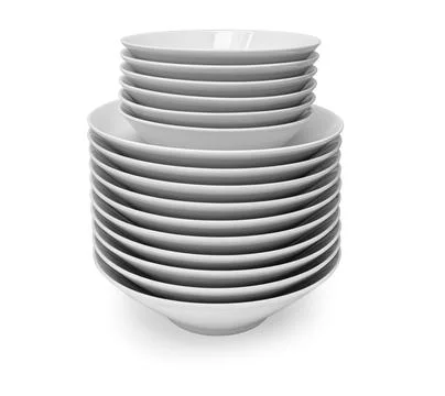A stack of white plates isolated Stock Photos