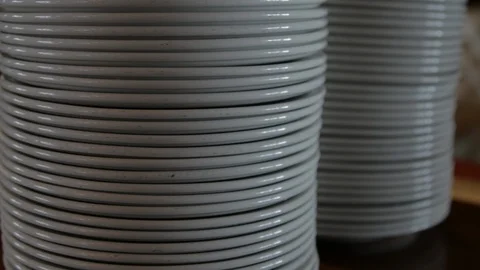 Stack of white plates tilt up shot Stock-Footage 103547497