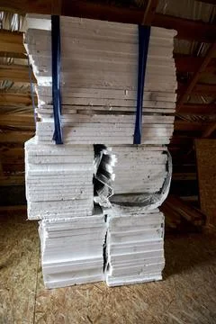 Stack of white polystyrene foam sheets, EPS insulation material inside attic  Stock Photos