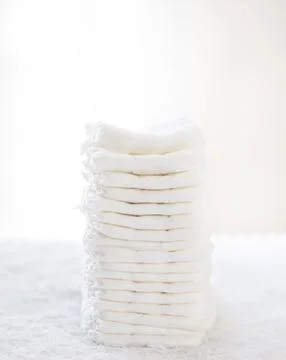 Stack of white soft new baby diapers Stock Photos