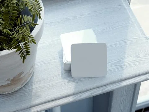 Stack of white square beer coasters on windowsill. 3d rendering 库存插图