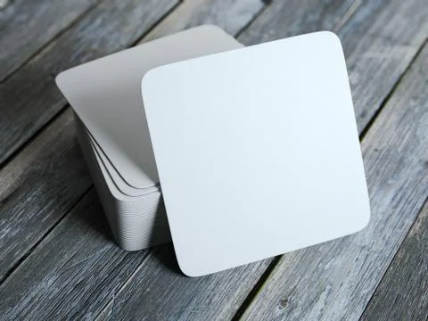 Stack of white square beer coasters Stock Illustration